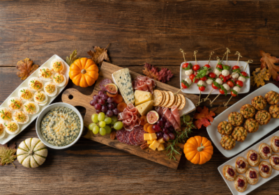 Thanksgiving appetizers spread with charcuterie board, deviled eggs and caprese skewers